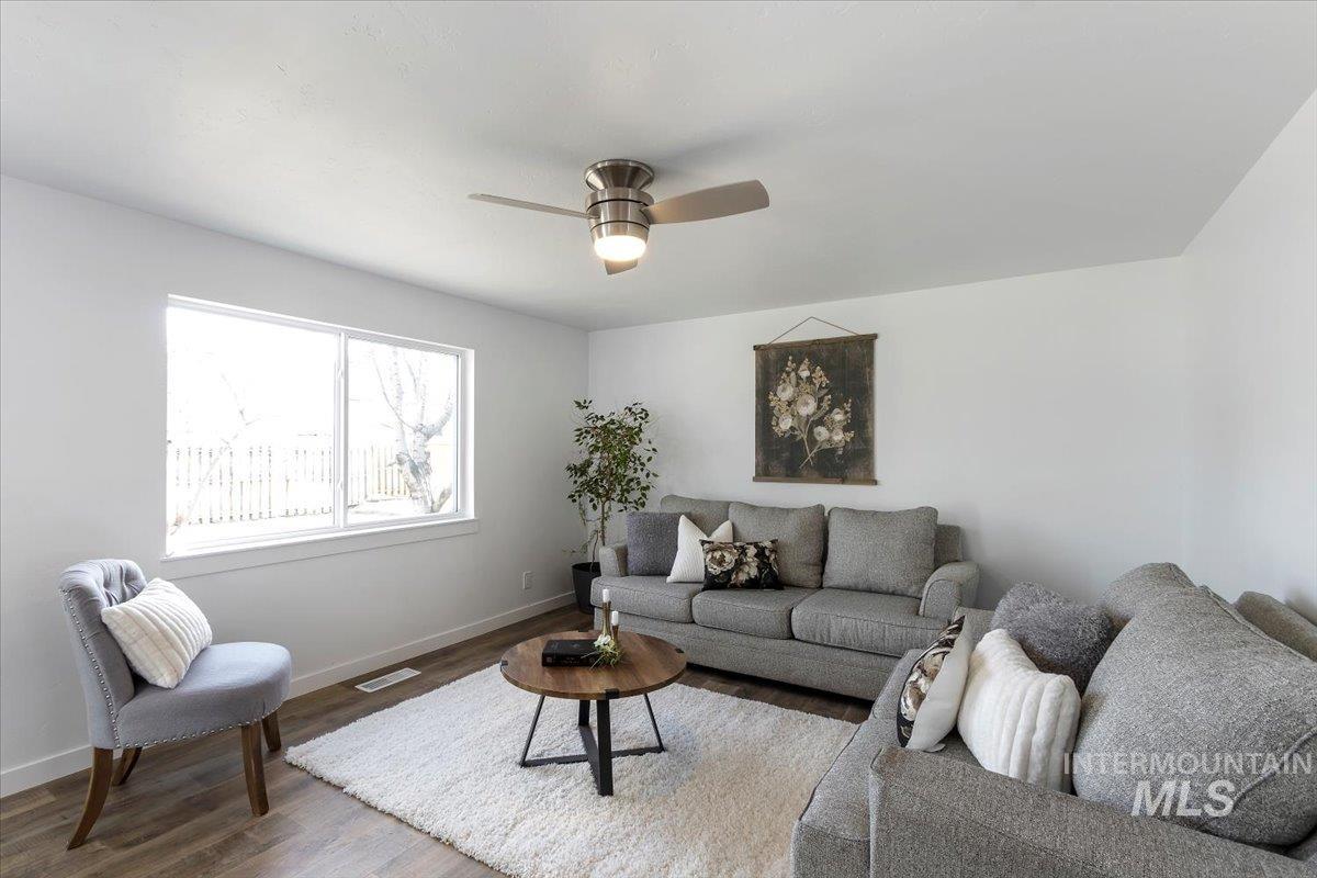 1184 Starfire Street Twin Falls, ID 83301 - Photo 9 of 34 Living area with wood finished floors and ceiling fan