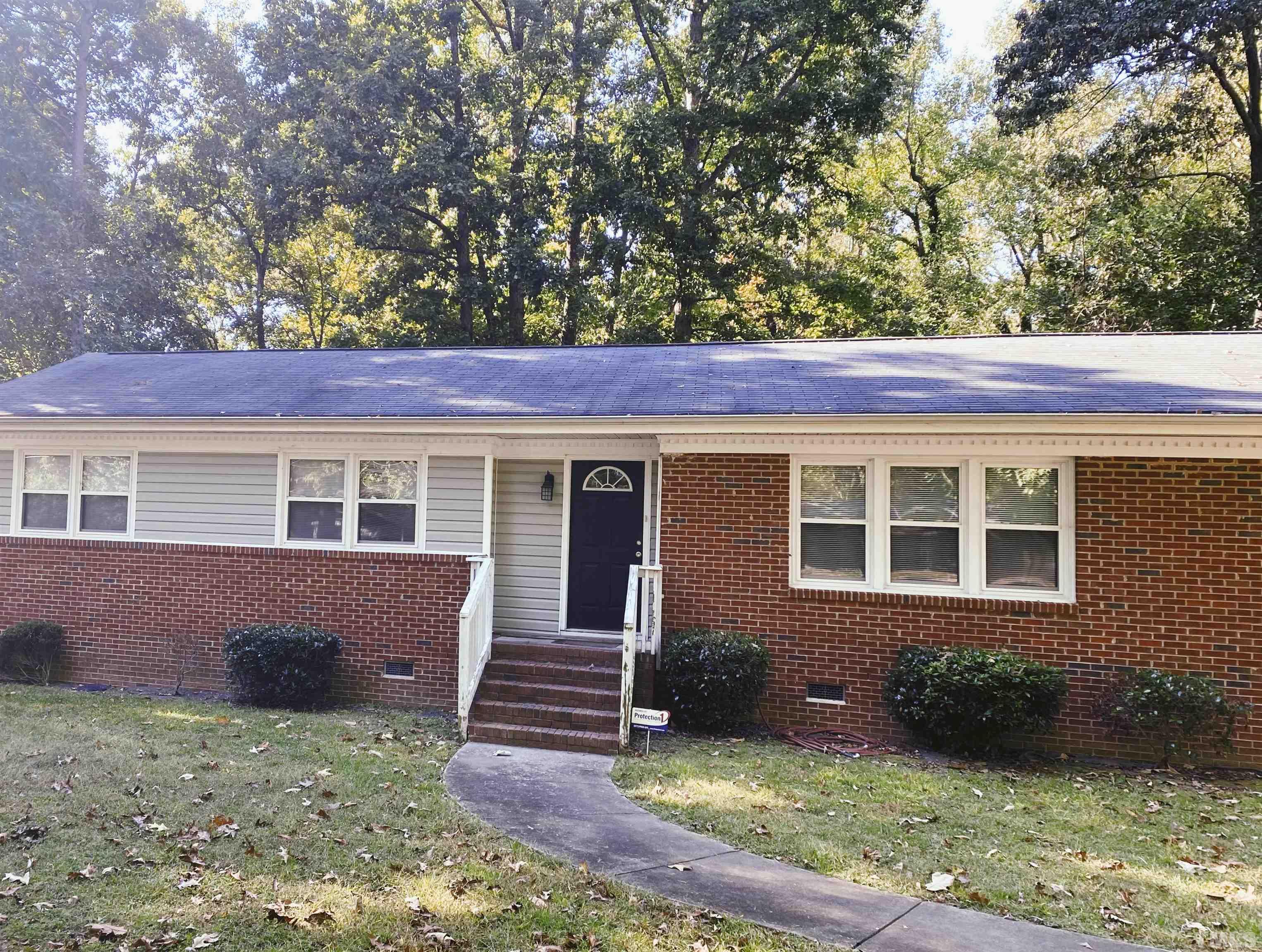 610 St George Road Raleigh, NC 27610 - Photo 1 of 9 front view of a house with a yard