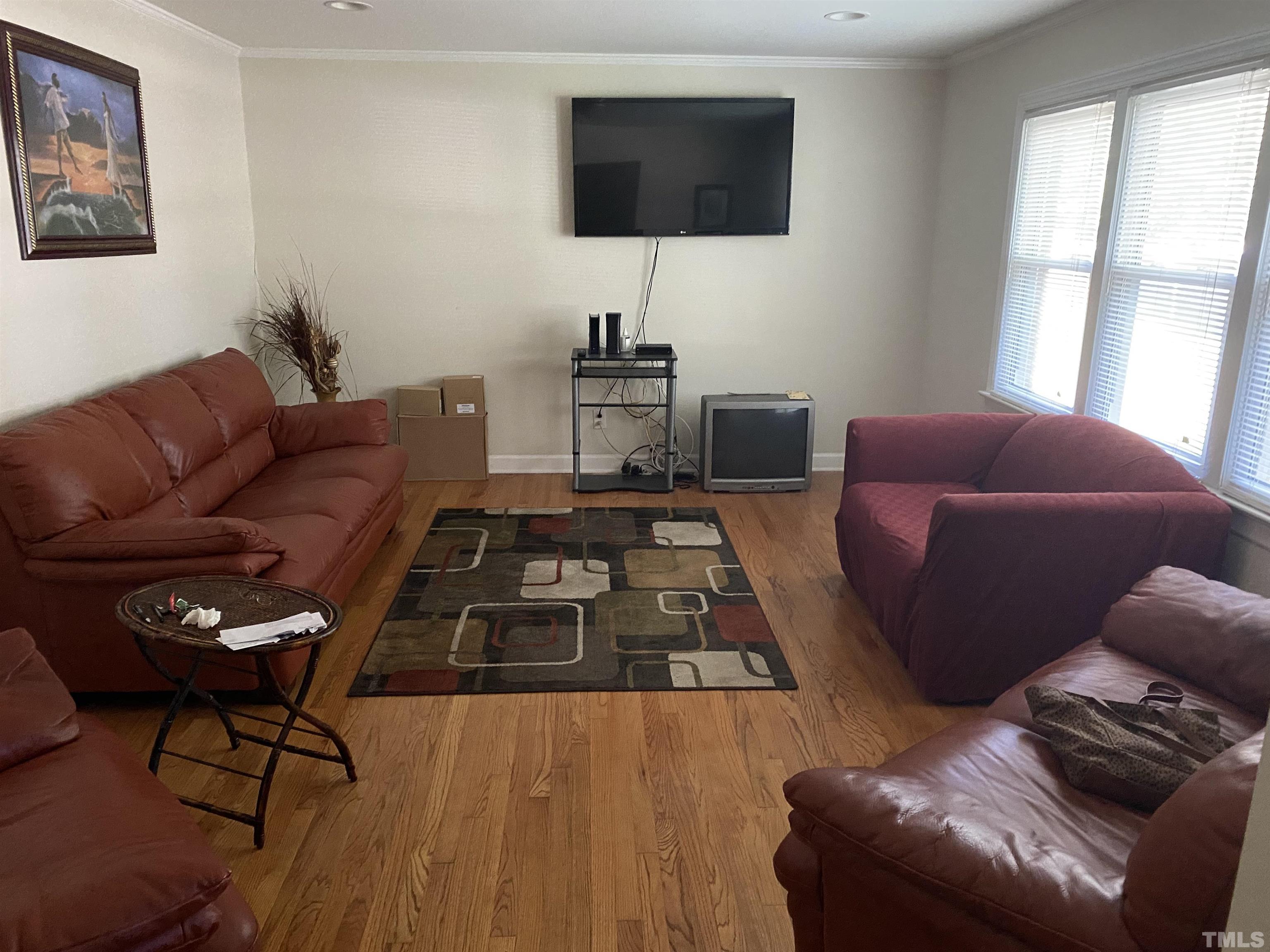 610 St George Road Raleigh, NC 27610 - Photo 2 of 9 a living room with furniture and a flat screen tv