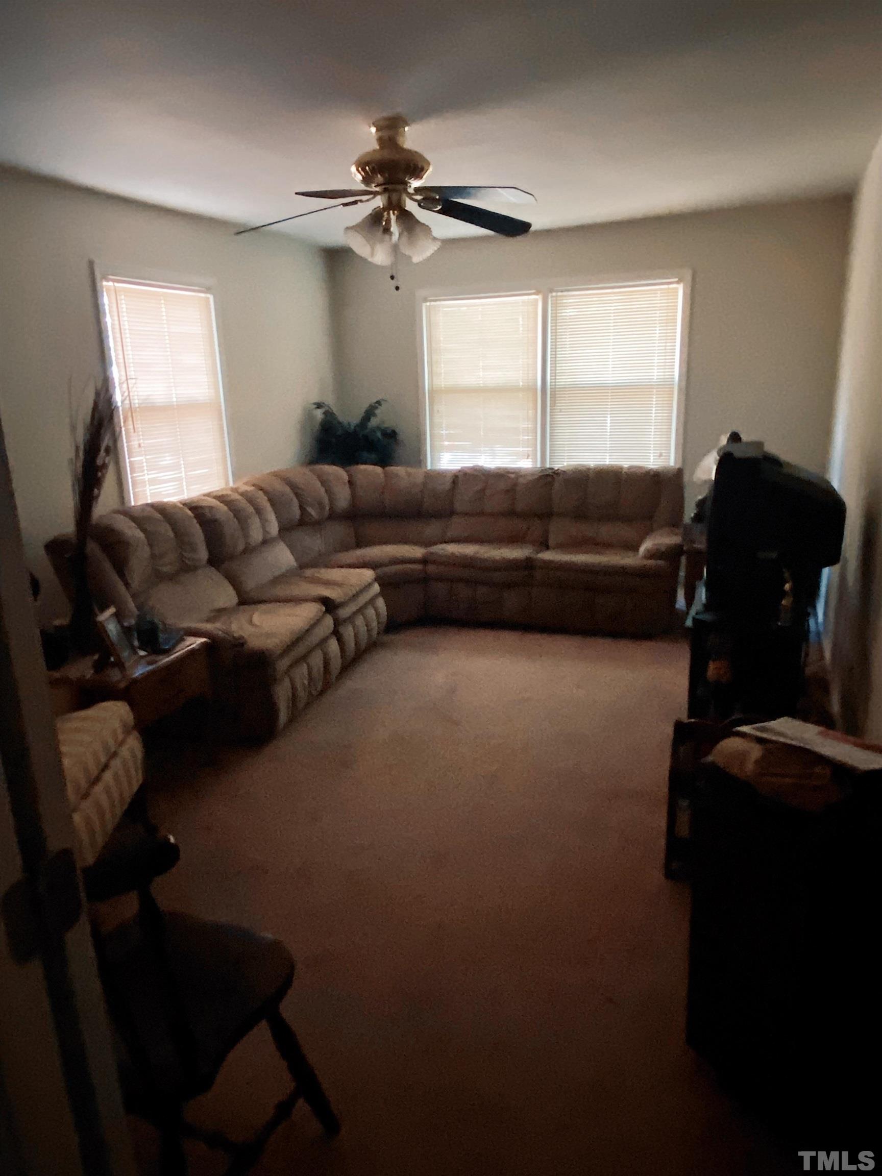 610 St George Road Raleigh, NC 27610 - Photo 5 of 9 a living room with furniture and a window