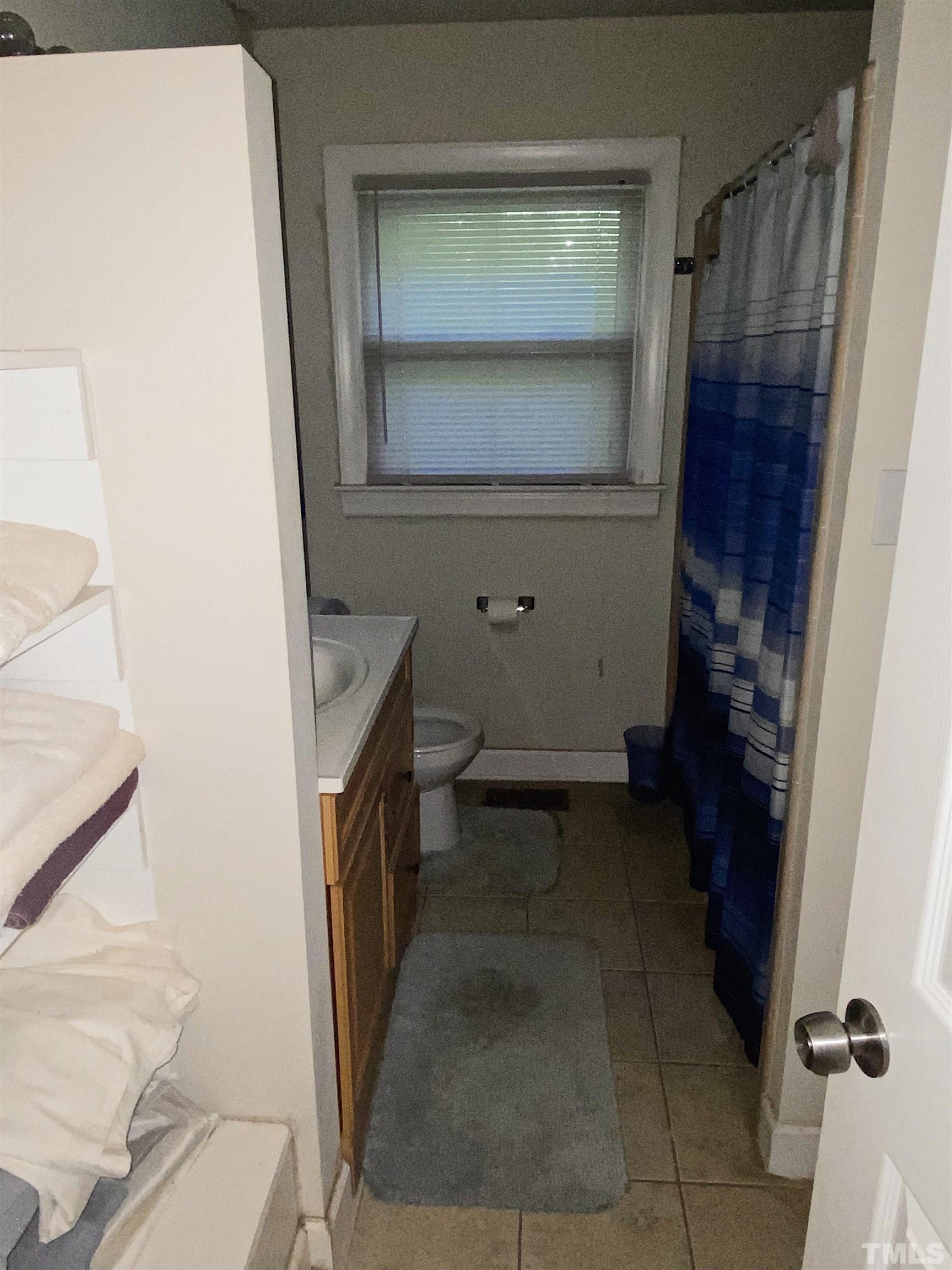 610 St George Road Raleigh, NC 27610 - Photo 6 of 9 a bathroom with a sink and a mirror