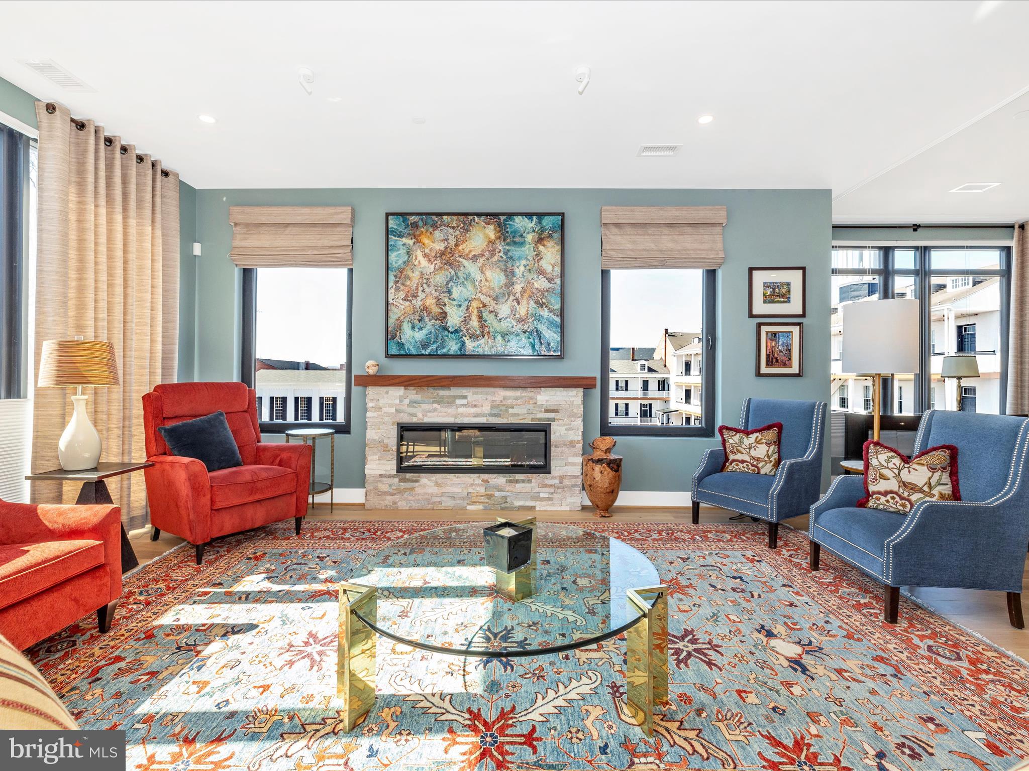 210 East 2nd Street, Unit 401 Frederick, MD 21701 - Photo 18 of 51 a living room with furniture and a fireplace