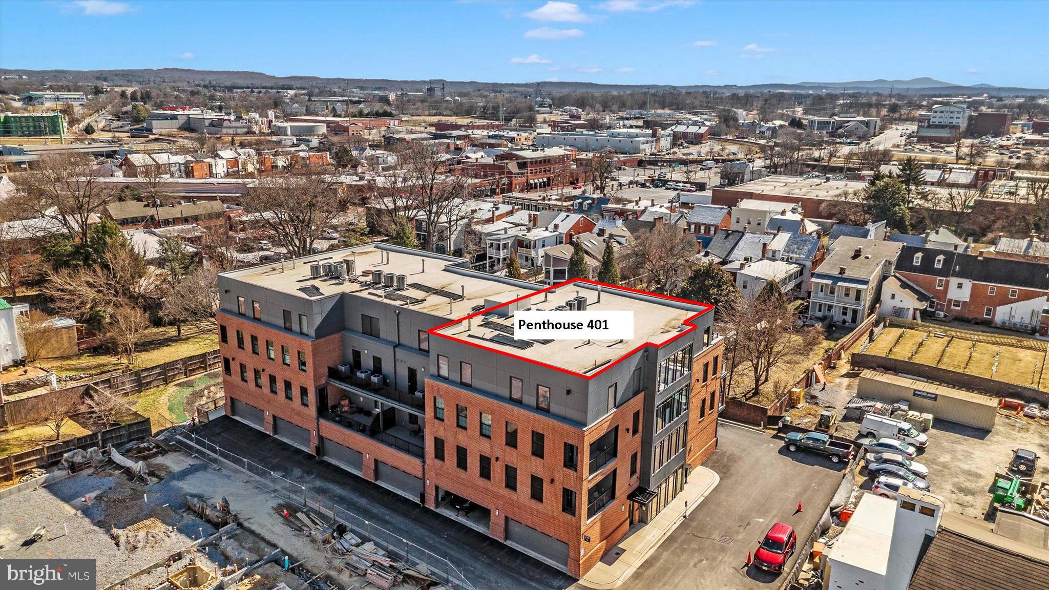 210 East 2nd Street, Unit 401 Frederick, MD 21701 - Photo 2 of 51 an aerial view of a large building with a city view
