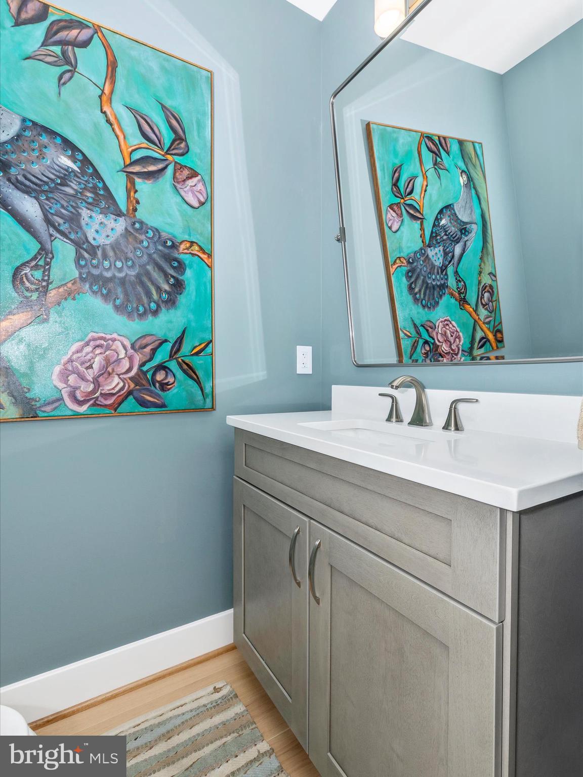 210 East 2nd Street, Unit 401 Frederick, MD 21701 - Photo 26 of 51 a bathroom with a sink a vanity and painting on the wall