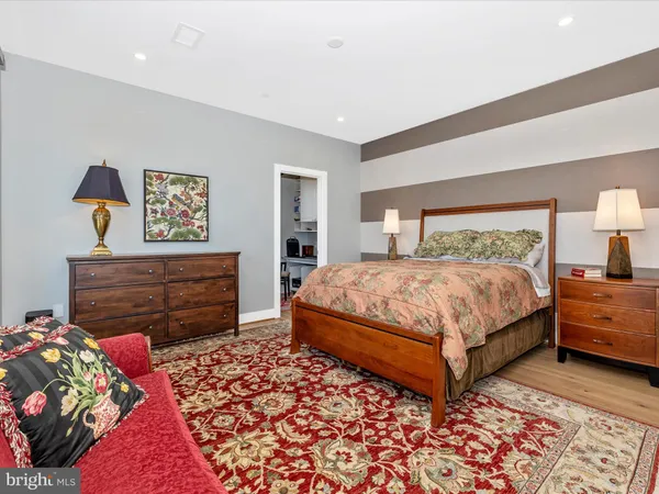 a bedroom with a bed and a dresser