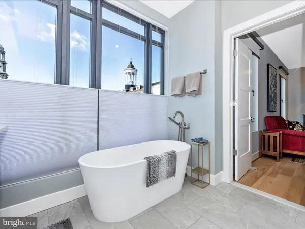 a white bath tub sitting in a bathroom