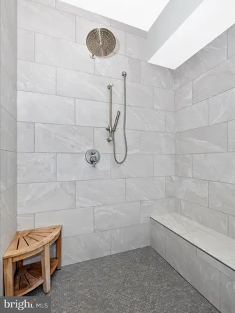 a white bath tub sitting in a bathroom