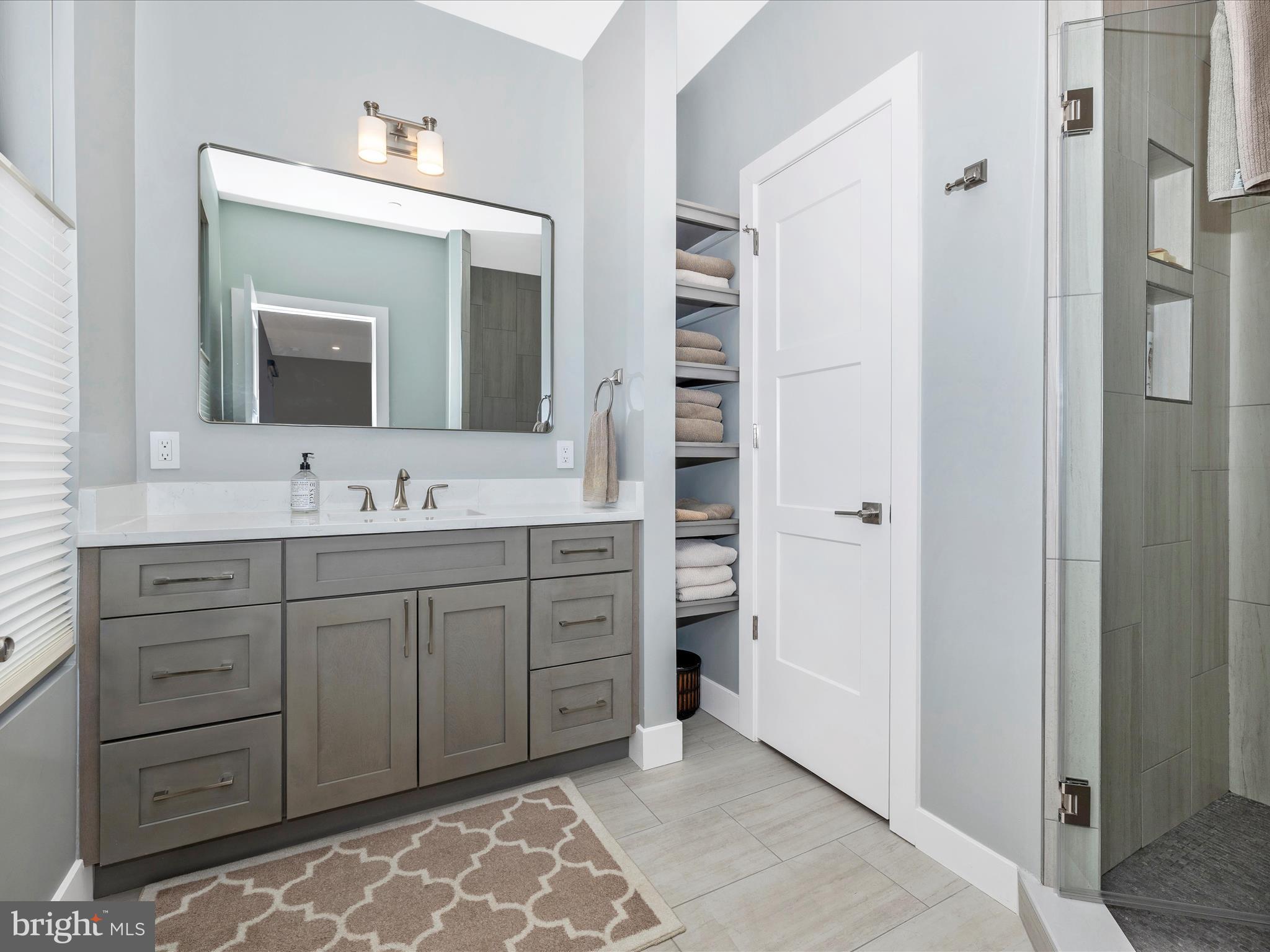 210 East 2nd Street, Unit 401 Frederick, MD 21701 - Photo 40 of 51 a spacious bathroom with a double vanity sink mirror and double