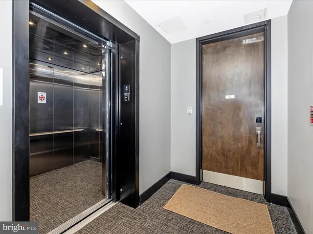 a view of elevator with hallway