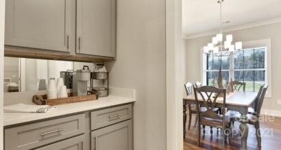 3409 Sincerity Road, Unit 15 Monroe, NC 28110 - Photo 12 of 32 a view of dining table chairs and chandelier