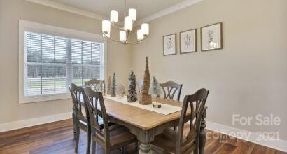 3409 Sincerity Road, Unit 15 Monroe, NC 28110 - Photo 2 of 32 a view of a dining room with furniture window and wooden floor