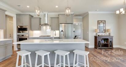 3409 Sincerity Road, Unit 15 Monroe, NC 28110 - Photo 21 of 32 a large kitchen with a table and chairs
