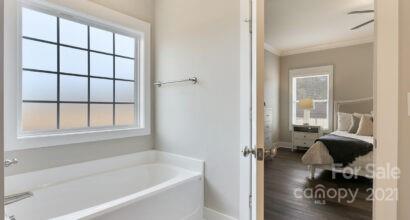 3409 Sincerity Road, Unit 15 Monroe, NC 28110 - Photo 25 of 32 a bath room with a bath tub and a shower