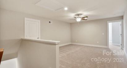 3409 Sincerity Road, Unit 15 Monroe, NC 28110 - Photo 26 of 32 an empty room with a window and a ceiling fan