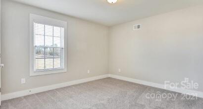 3409 Sincerity Road, Unit 15 Monroe, NC 28110 - Photo 28 of 32 an empty room with a window