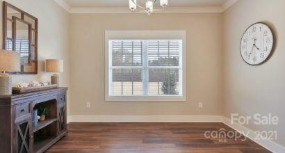 3409 Sincerity Road, Unit 15 Monroe, NC 28110 - Photo 8 of 32 a view of a livingroom with wooden floor and a large window