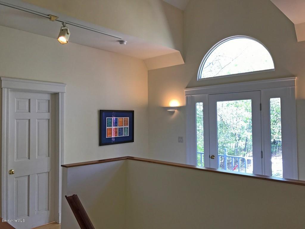 7 Cider Mill Road Williamsburg, MA 01039 - Photo 14 of 30 a view of a livingroom with wooden floor and a large window