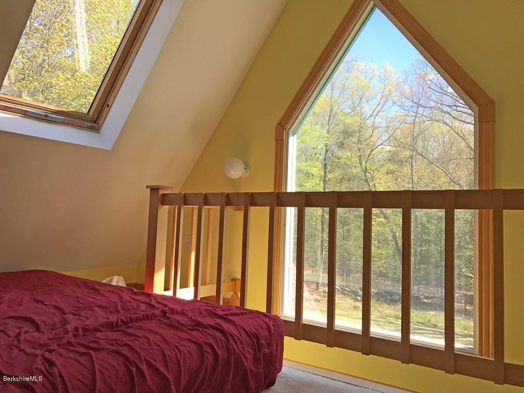 7 Cider Mill Road Williamsburg, MA 01039 - Photo 17 of 30 a bedroom with a bed and a large window
