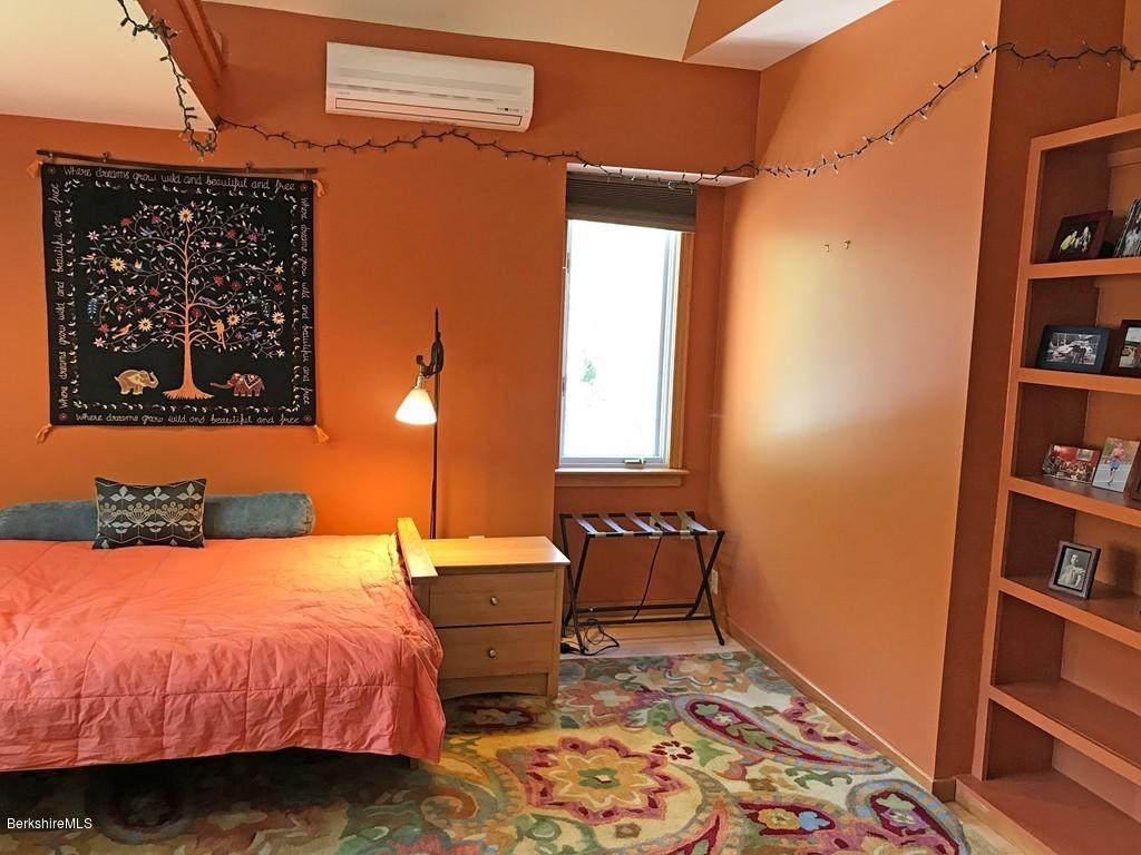 7 Cider Mill Road Williamsburg, MA 01039 - Photo 18 of 30 a bedroom with a bed and a window