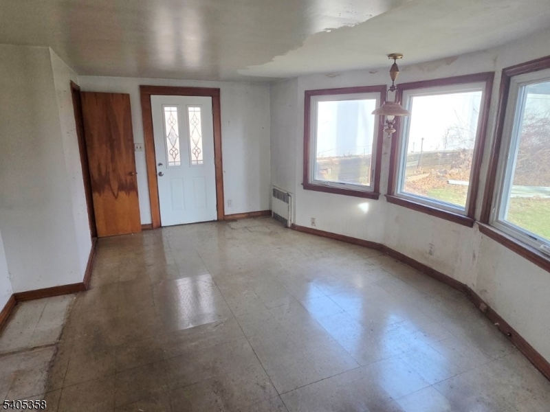 377 Lum Avenue Union, NJ 07083 - Photo 2 of 13 an empty room with windows and closet