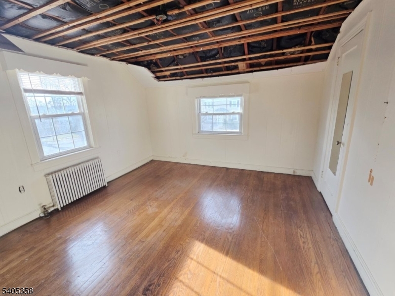 377 Lum Avenue Union, NJ 07083 - Photo 10 of 13 a view of a room with wooden floor and windows