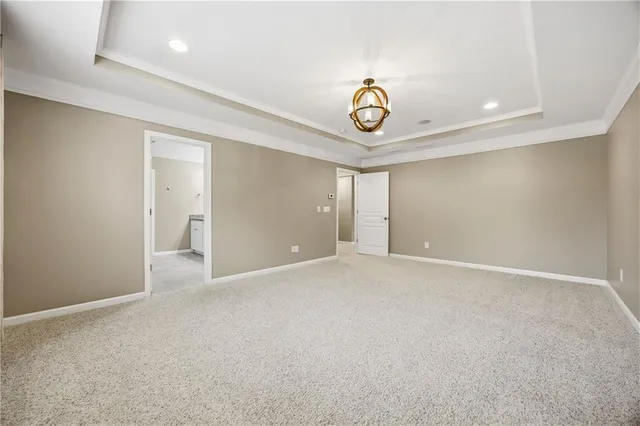 an empty room with a chandelier