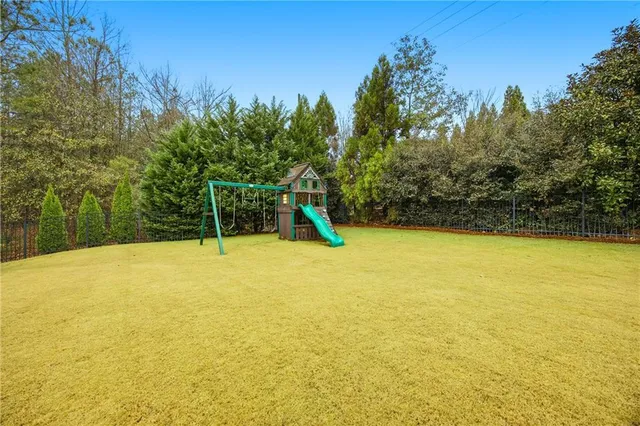 a view of a swimming pool with an outdoor space and seating area