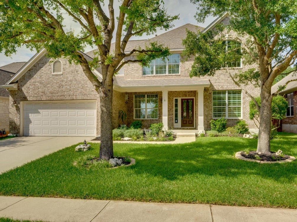 front view of a house with a yard