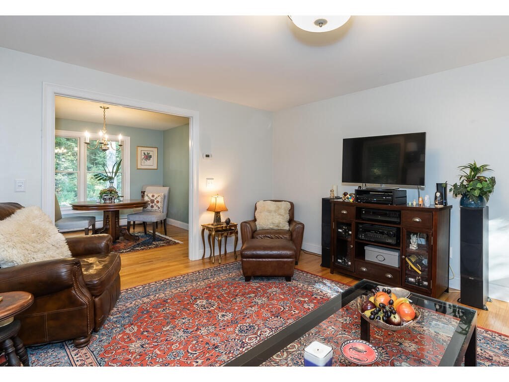 79 Pomeroy Meadow Road Southampton, MA 01073 - Photo 12 of 42 a living room with furniture and a flat screen tv