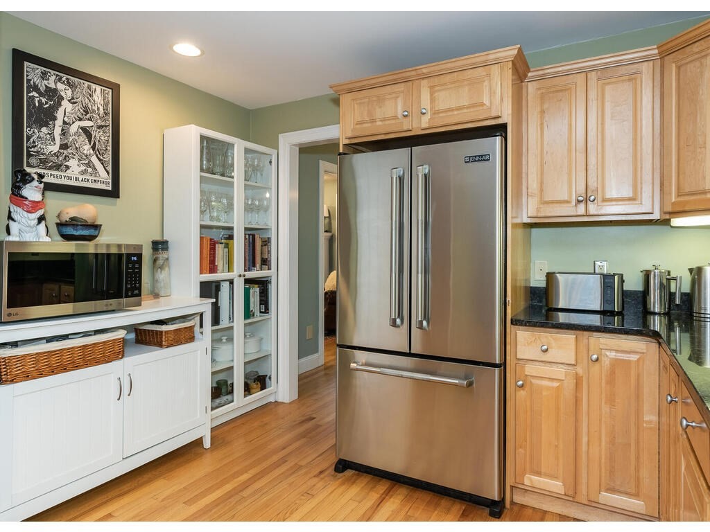 79 Pomeroy Meadow Road Southampton, MA 01073 - Photo 20 of 42 a kitchen with stainless steel appliances granite countertop a refrigerator and a stove top oven