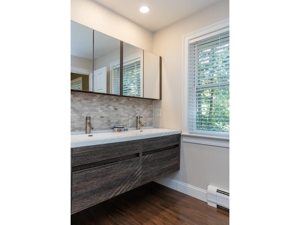 79 Pomeroy Meadow Road Southampton, MA 01073 - Photo 32 of 42 a bathroom with a sink and a mirror