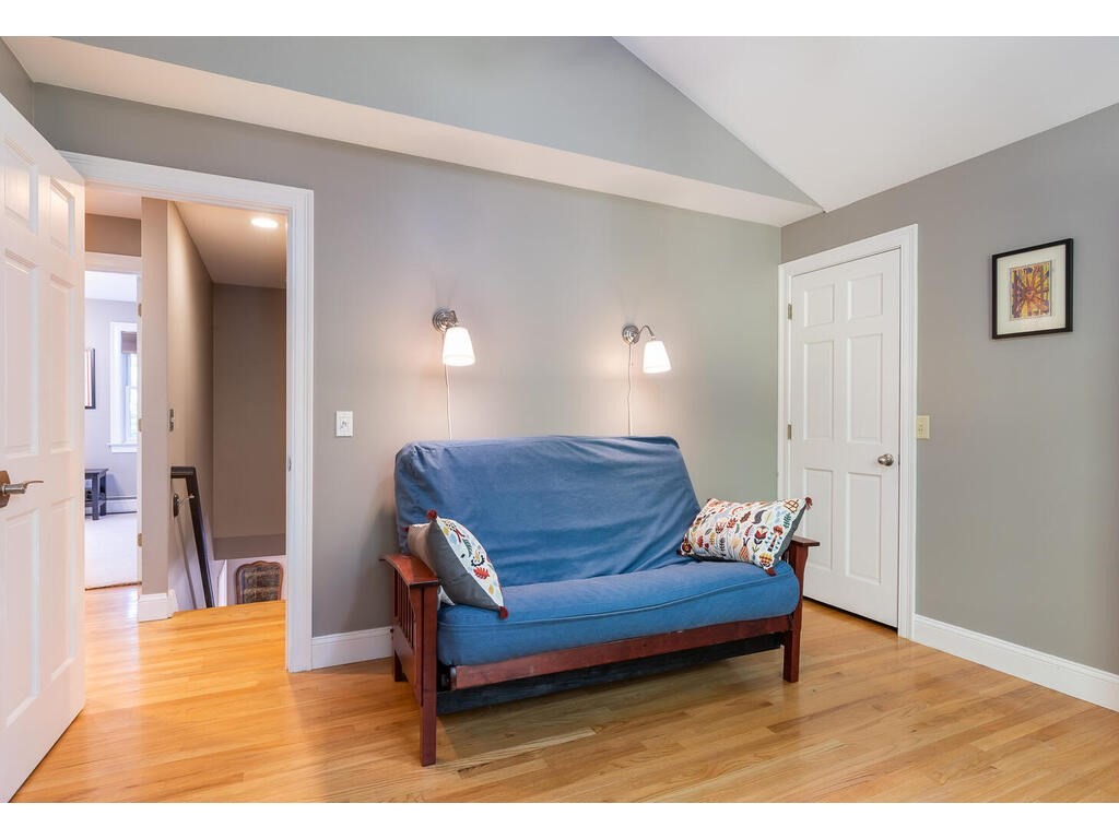 79 Pomeroy Meadow Road Southampton, MA 01073 - Photo 36 of 42 a living room with furniture and a wooden floor
