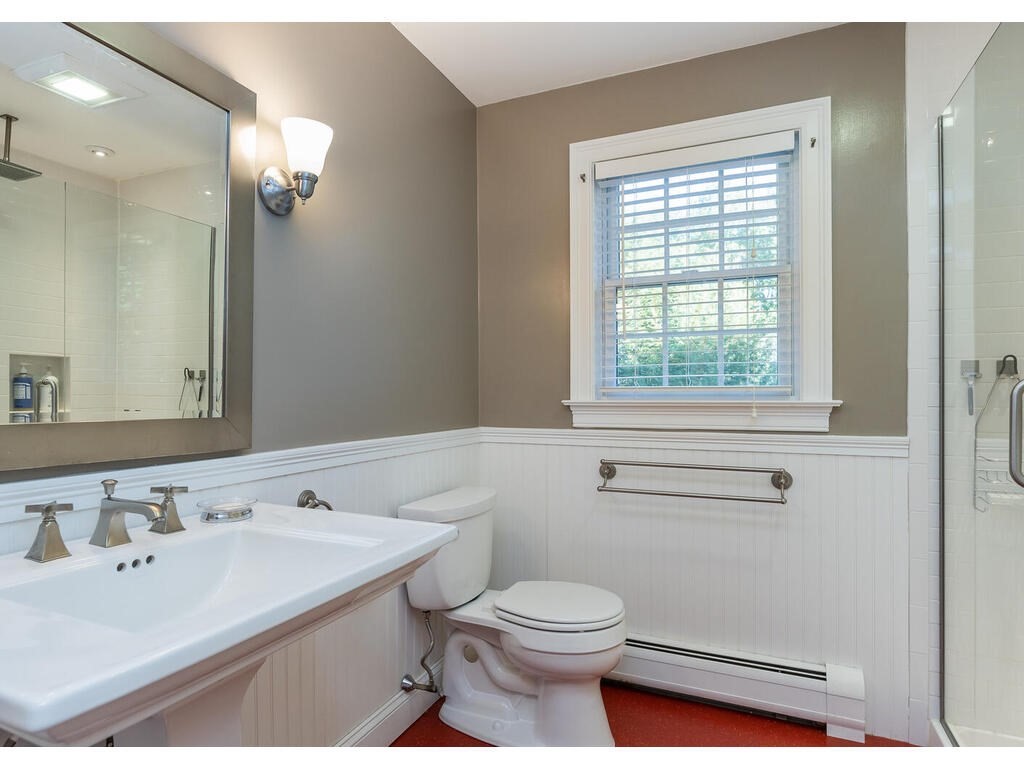 79 Pomeroy Meadow Road Southampton, MA 01073 - Photo 42 of 42 a bathroom with a sink vanity granite toilet and a mirror