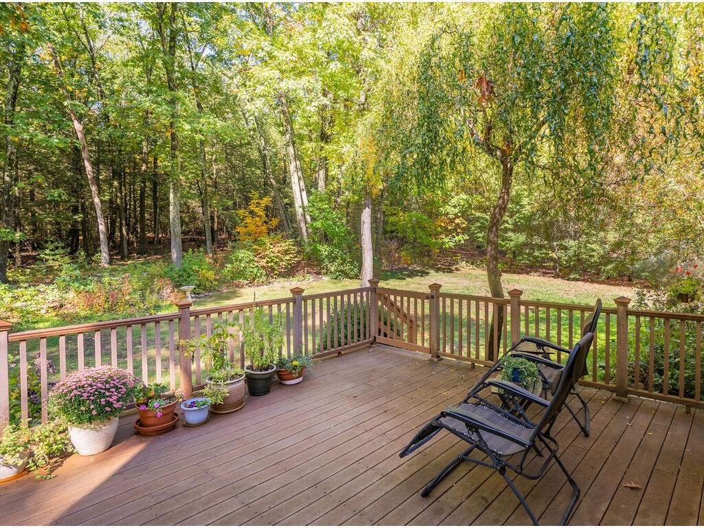 79 Pomeroy Meadow Road Southampton, MA 01073 - Photo 6 of 42 a view of a wooden deck with chairs
