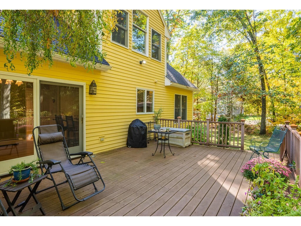 79 Pomeroy Meadow Road Southampton, MA 01073 - Photo 7 of 42 a view of a chairs and table on the wooden deck
