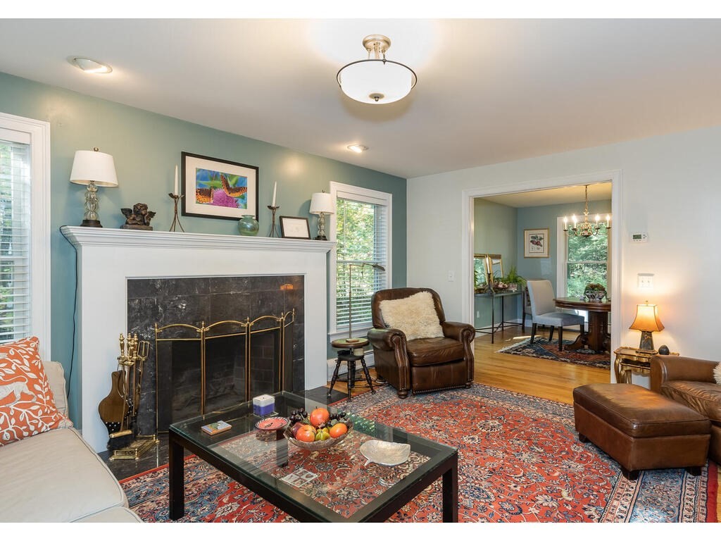 79 Pomeroy Meadow Road Southampton, MA 01073 - Photo 10 of 42 a living room with furniture and a fireplace