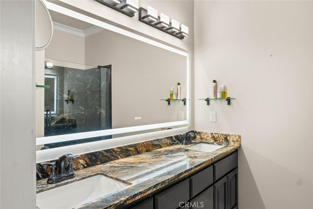 12138 Centerville Road Chico, CA 95928 - Photo 19 of 53 Updated granite counter with double sink and defrosting mirror