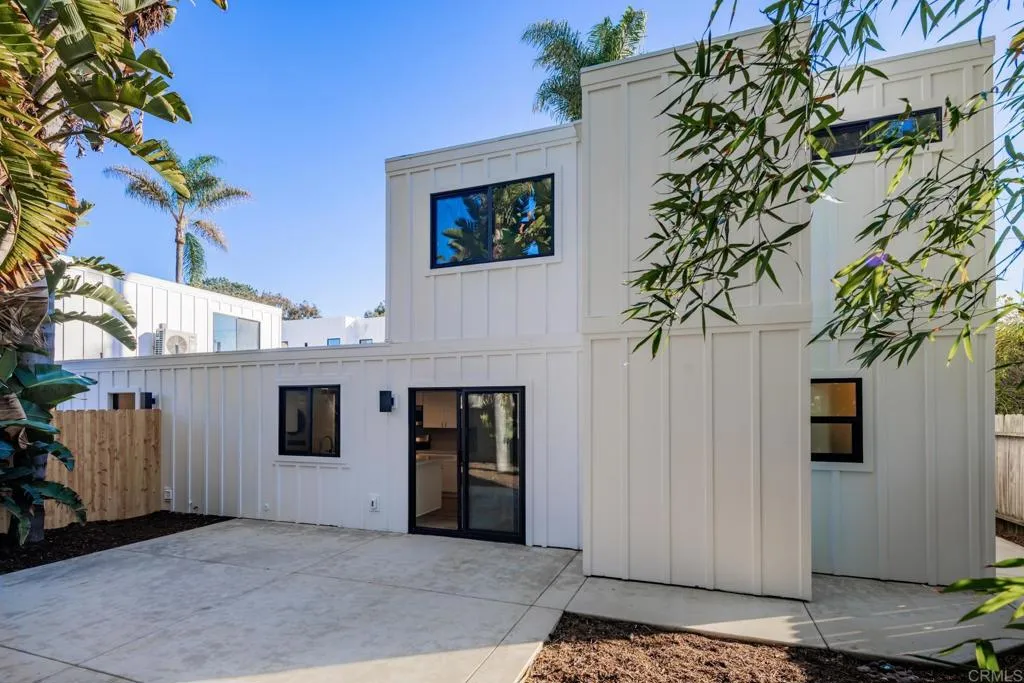 250 Hillcrest Drive Encinitas, CA 92024 - Photo 20 of 54 a view of a house with a potted plant and a garage