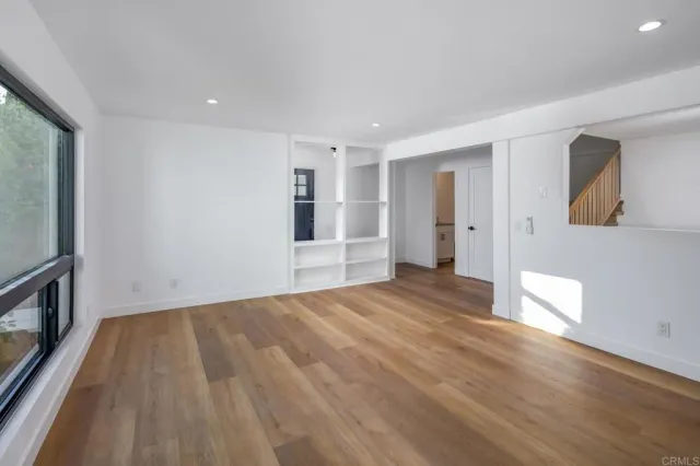 an empty room with large window