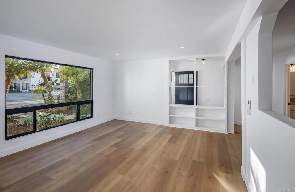 250 Hillcrest Drive Encinitas, CA 92024 - Photo 25 of 54 a view of empty room with wooden floor and fan