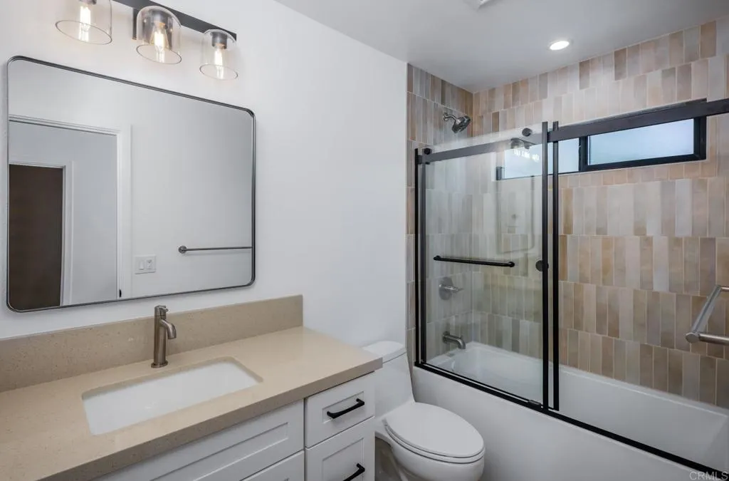 250 Hillcrest Drive Encinitas, CA 92024 - Photo 35 of 54 a bathroom with a sink toilet and shower