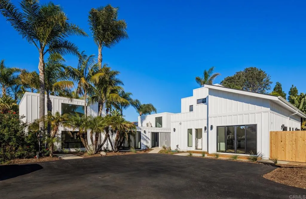 250 Hillcrest Drive Encinitas, CA 92024 - Photo 3 of 54 a front view of a house with a yard