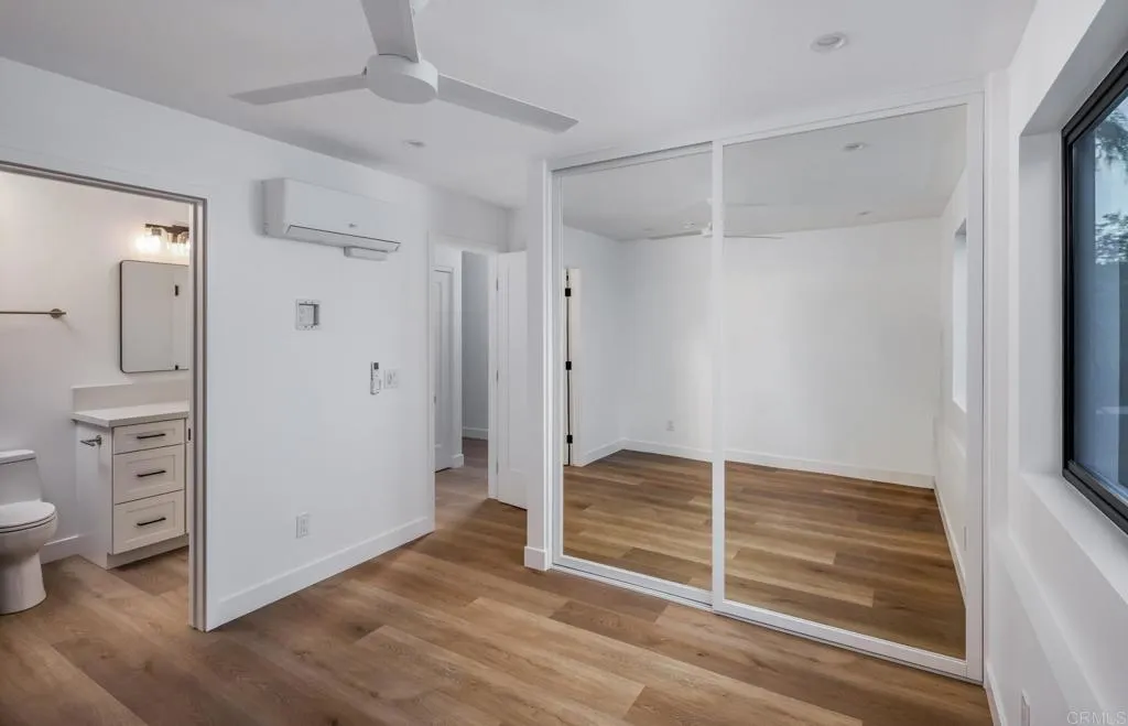 250 Hillcrest Drive Encinitas, CA 92024 - Photo 42 of 54 a view of empty room with wooden floor and fan