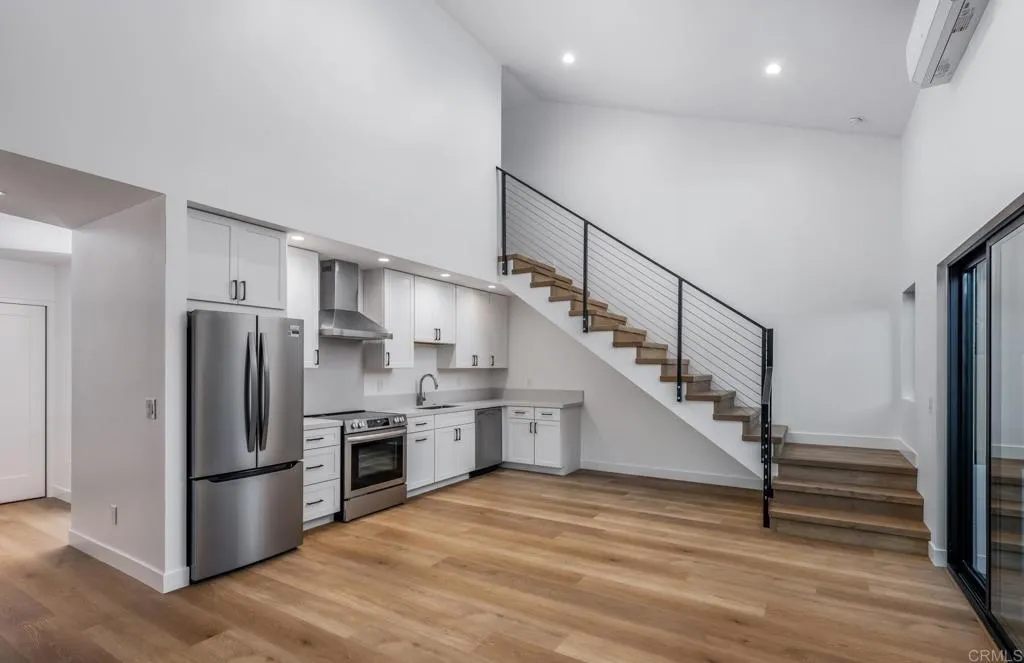 250 Hillcrest Drive Encinitas, CA 92024 - Photo 51 of 54 a kitchen with stainless steel appliances a refrigerator and a stove top oven