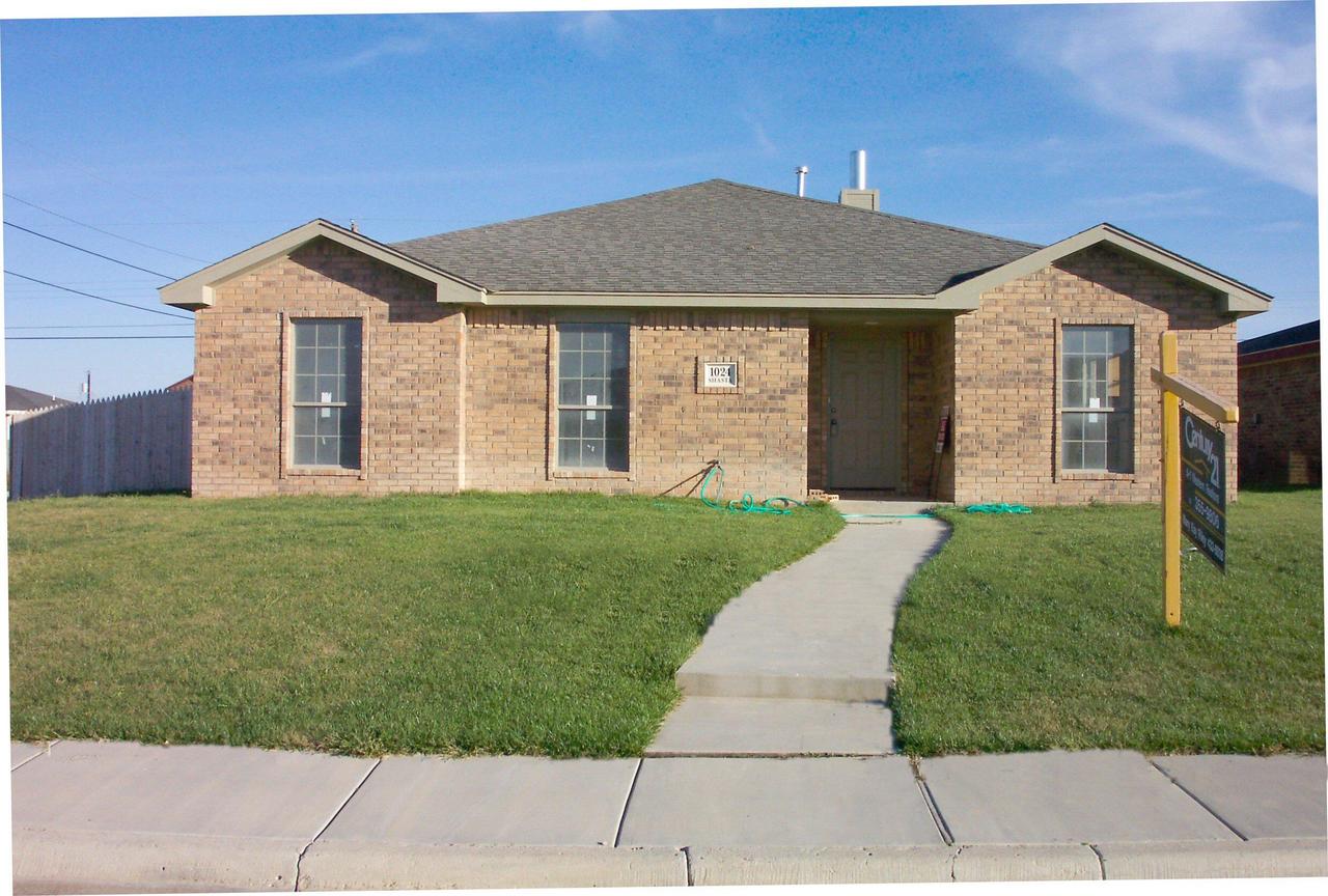 1024 Shasta Drive Amarillo, TX 79110 - Photo 1 of 5 a front view of a house with a yard