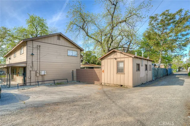 a view of a house with a yard and garage