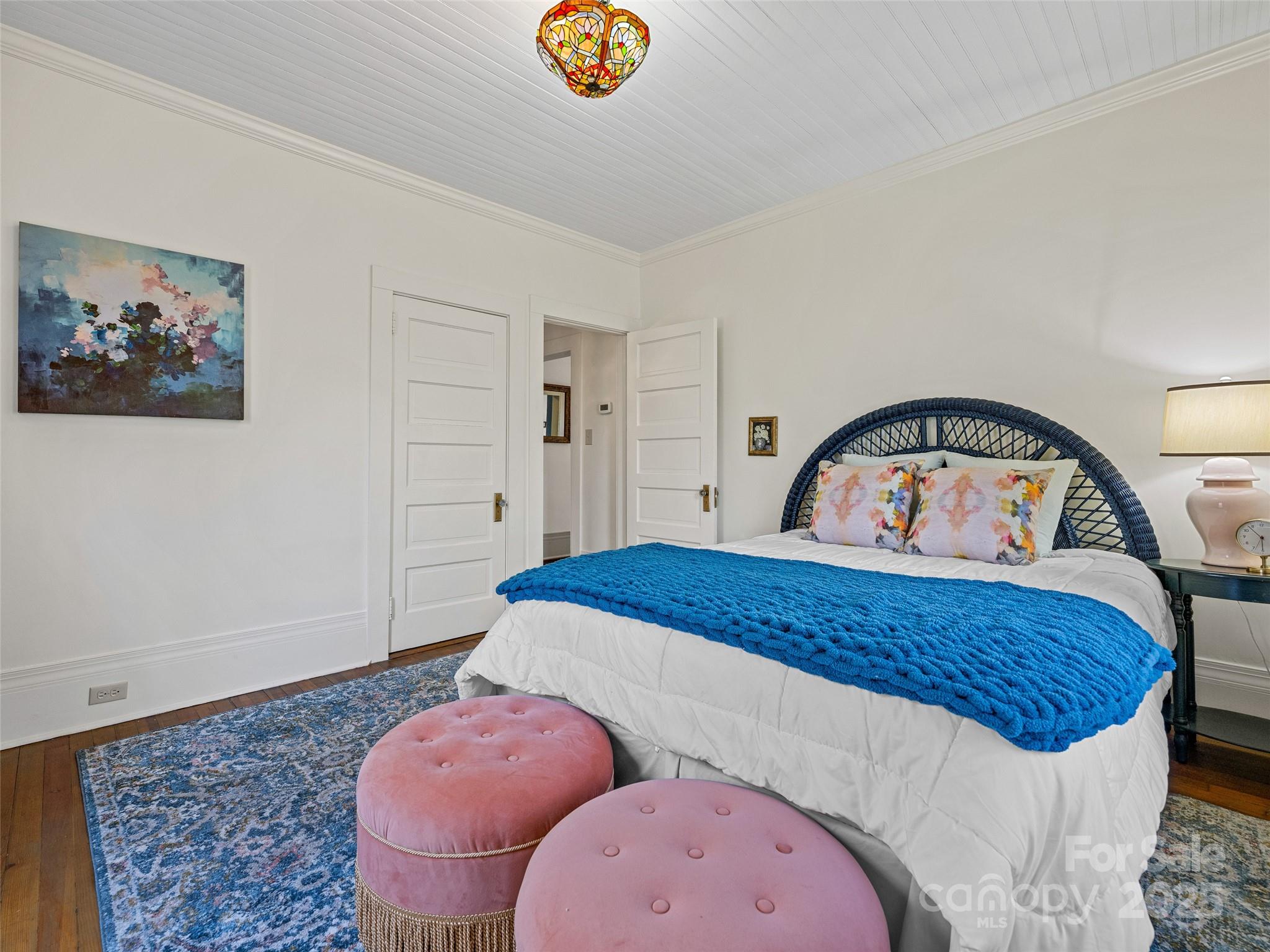 277 Markham Road Tryon, NC 28782 - Photo 11 of 44 a bedroom with a bed and a painting on the wall