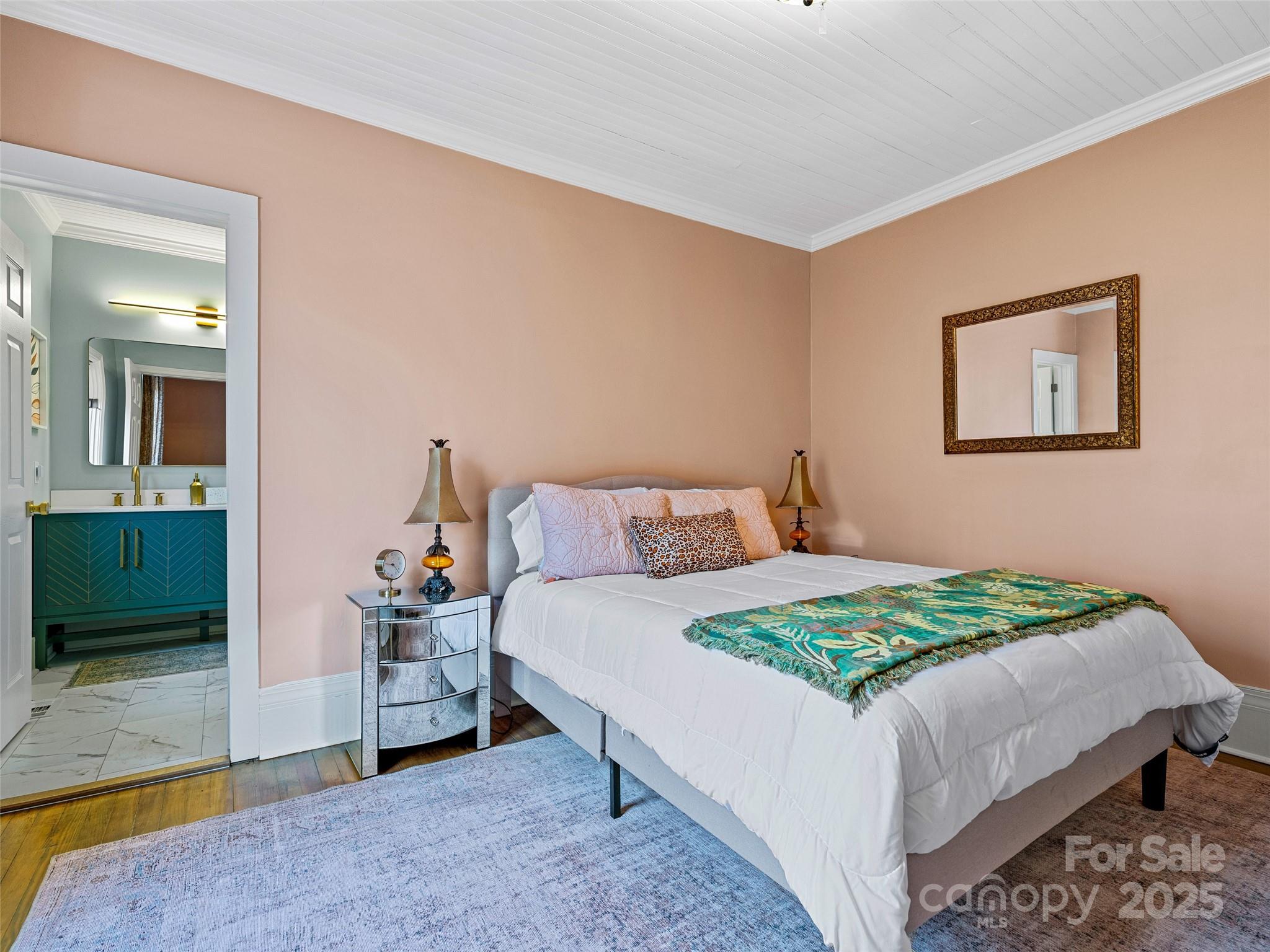 277 Markham Road Tryon, NC 28782 - Photo 17 of 44 a bedroom with a bed and a mirror