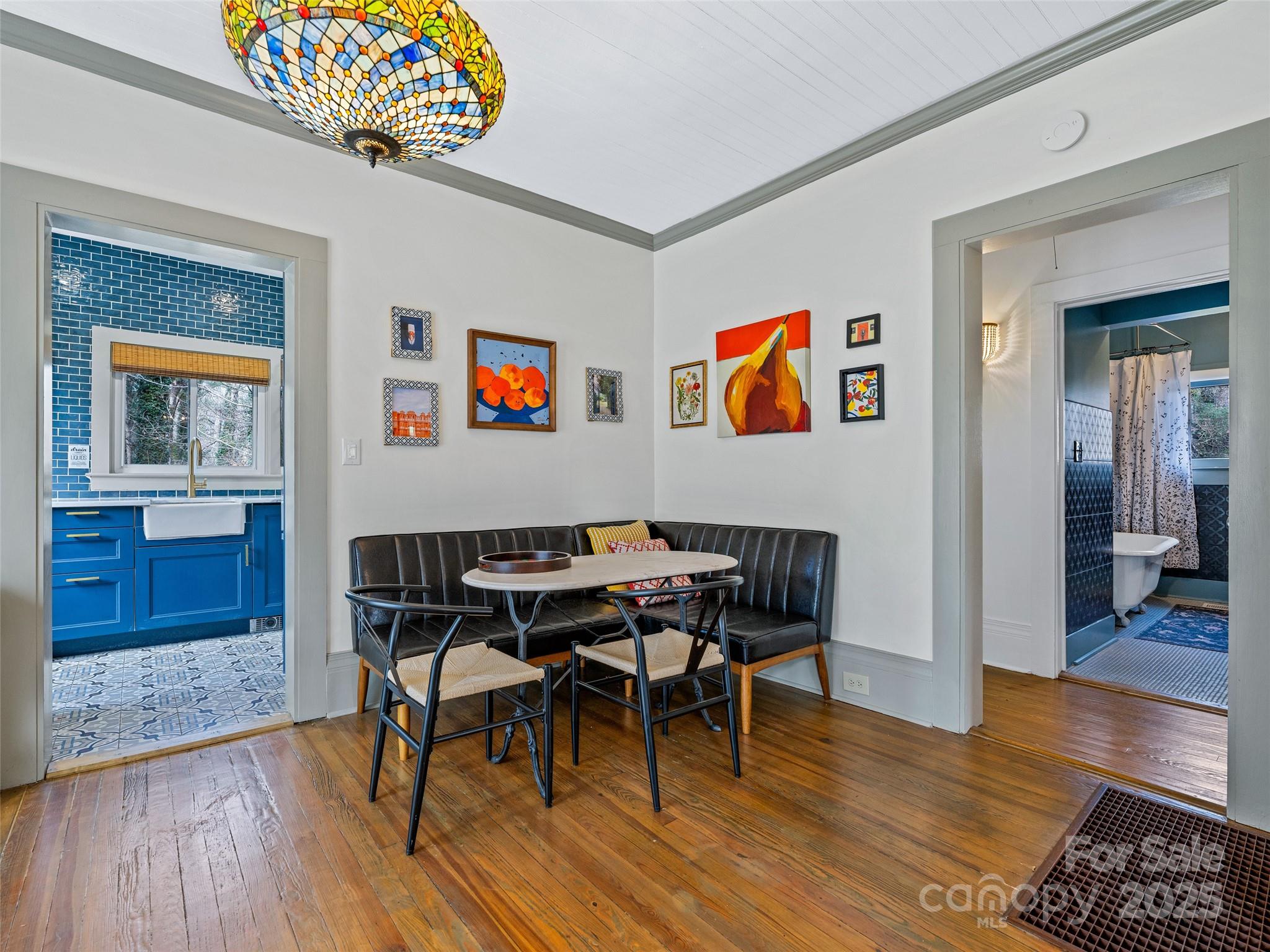 277 Markham Road Tryon, NC 28782 - Photo 18 of 44 a view of a dining room with furniture wooden floor and a rug
