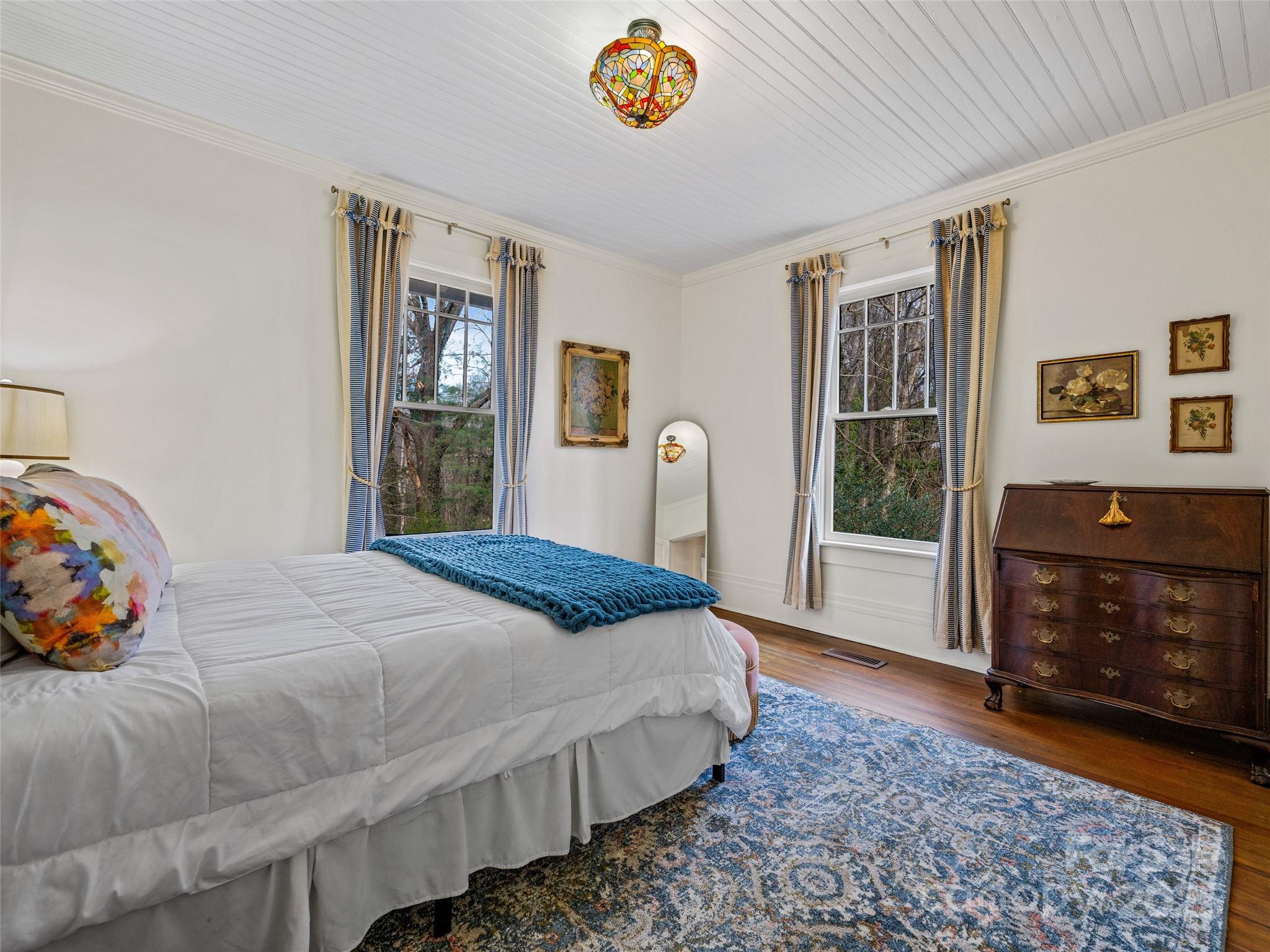 277 Markham Road Tryon, NC 28782 - Photo 22 of 44 a bedroom with a bed and a window